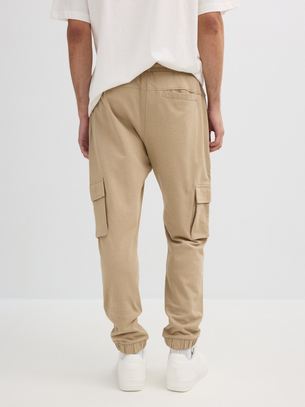 Sport jogger pants beige middle back view