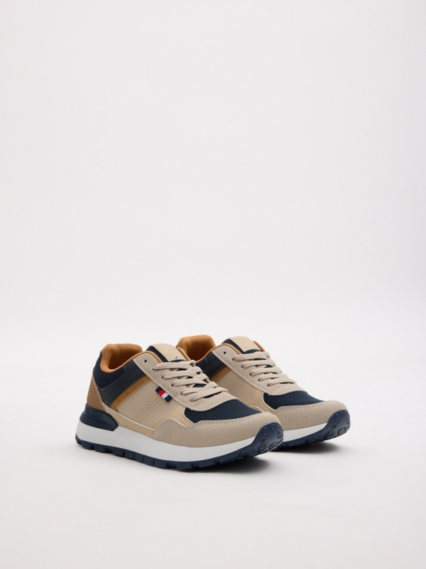 Zapatilla deportiva combinada marino crudo vista frontal 45º