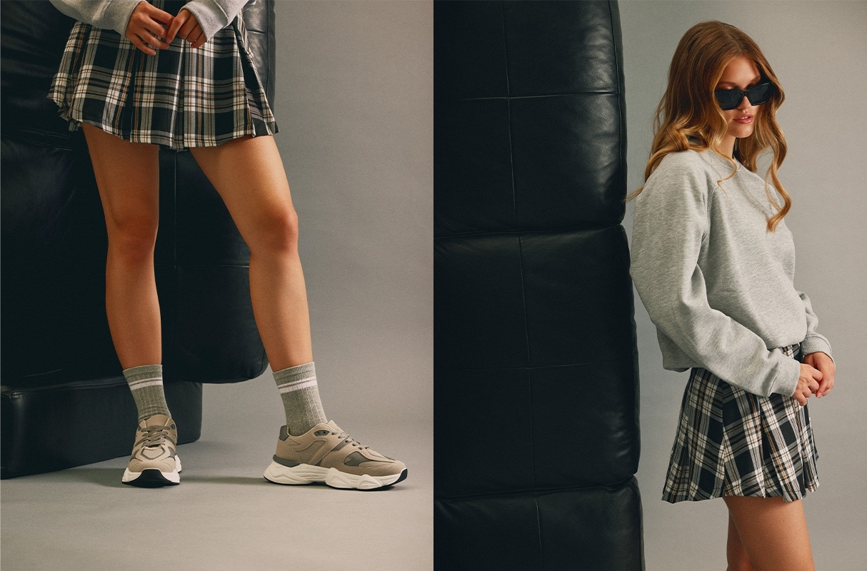 Mini-saia axadrezada preto vista meia frontal