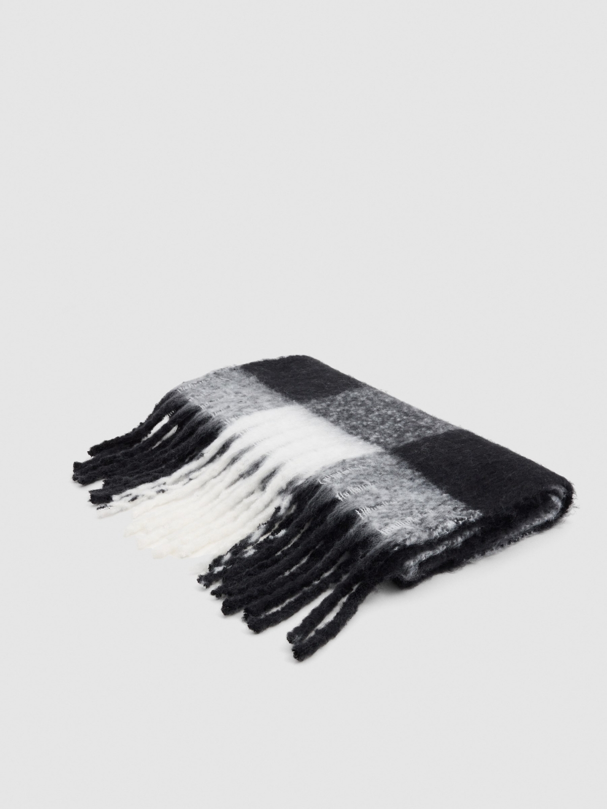 White and black checkered scarf with fringes black rolled view
