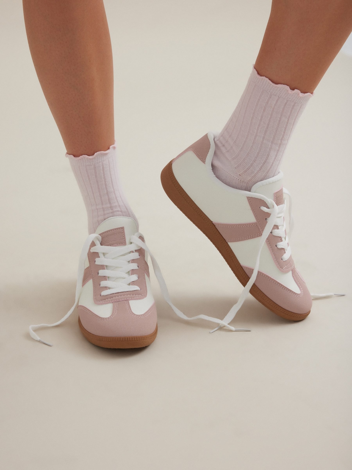 Retro low pink sneakers off white with a model