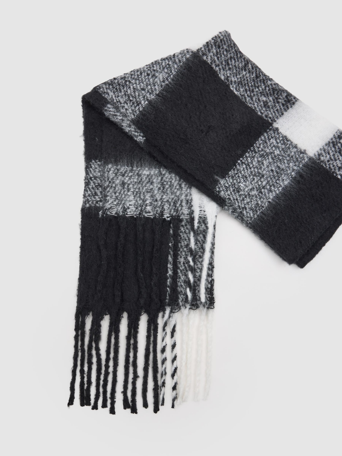 White and black checkered scarf with fringes black rolled view