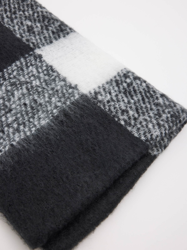 White and black checkered scarf with fringes black folded view