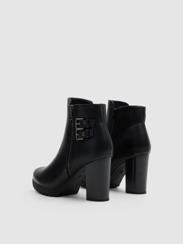 High heel buckle boot black 45º back view