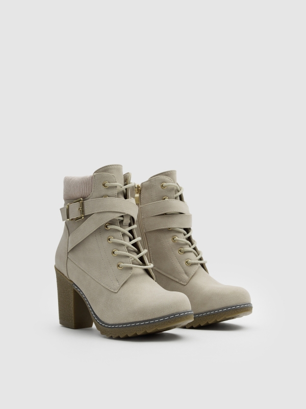 Lace-up heeled boot with crossed straps raw 45º front view