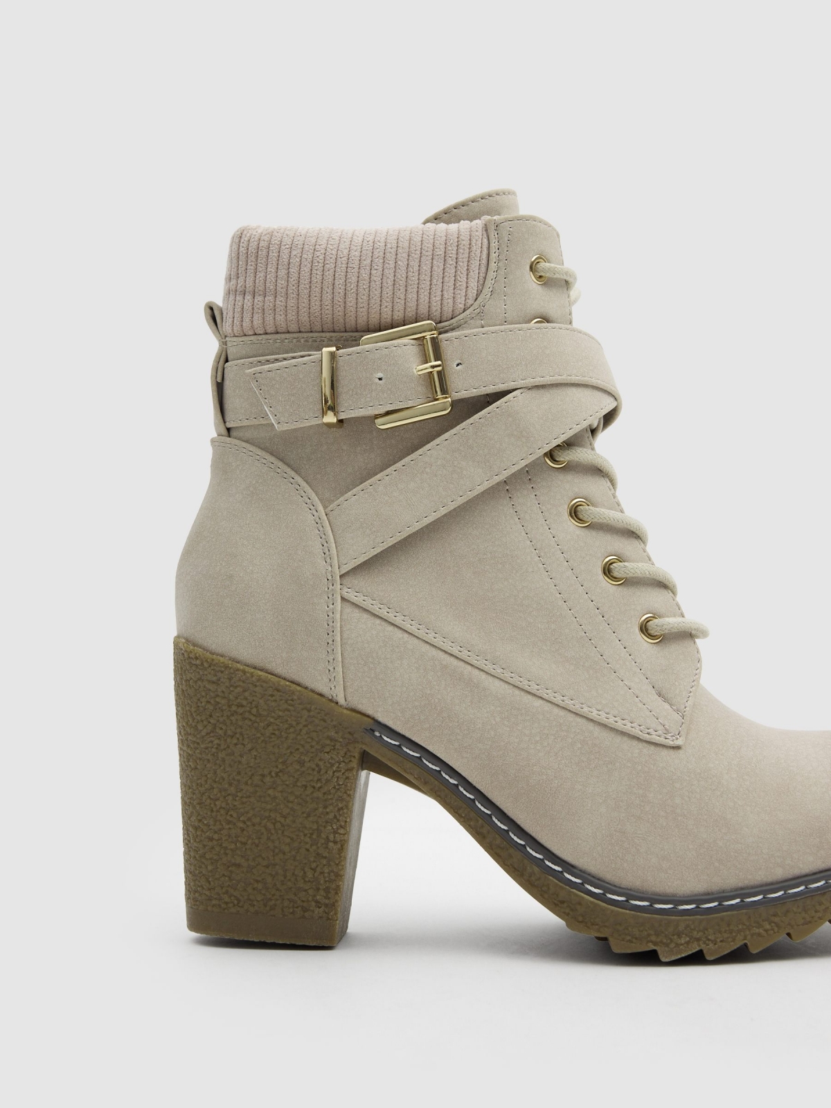 Lace-up heeled boot with crossed straps raw zenithal view