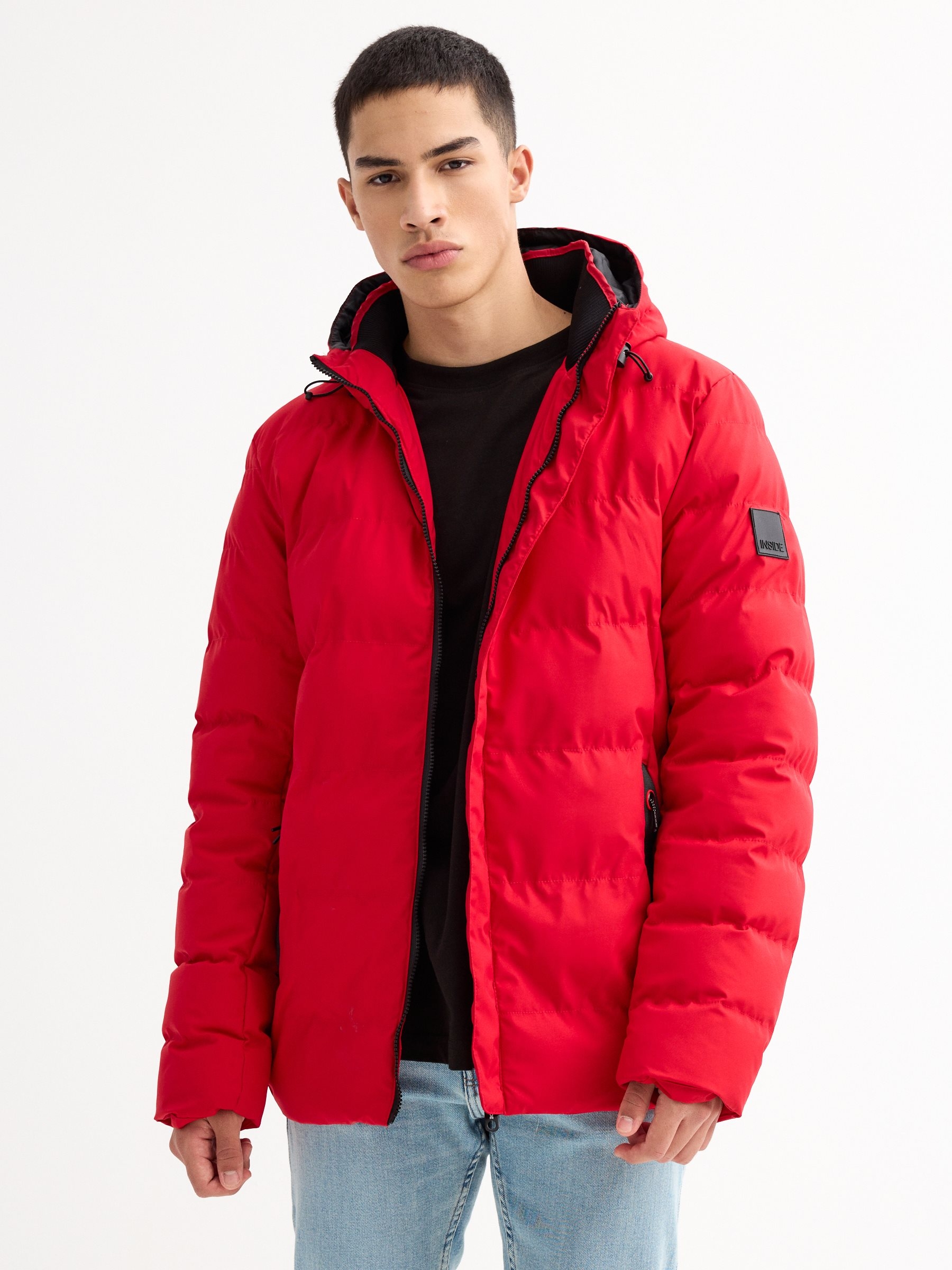 Black padded jacket red middle front view