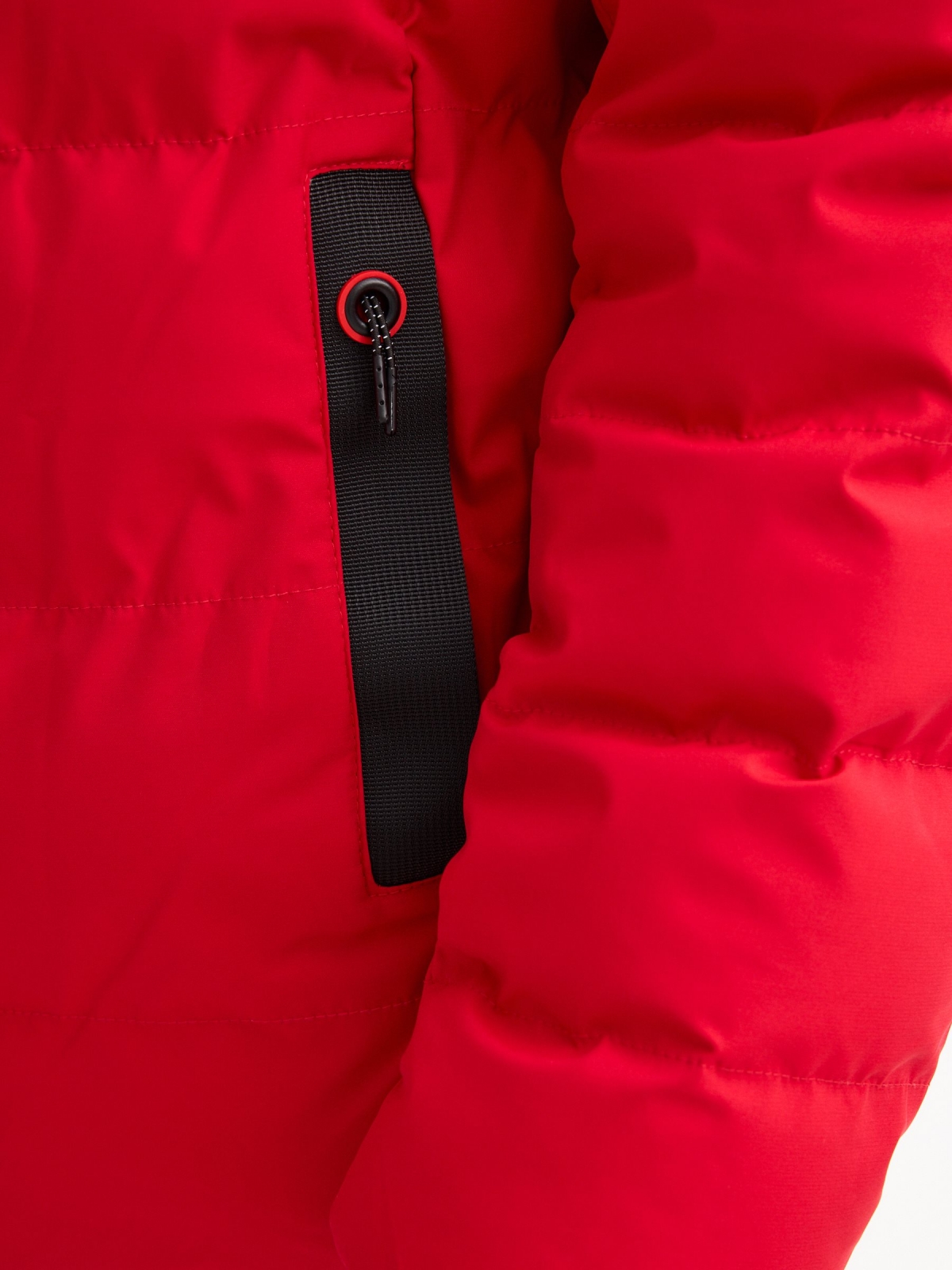Black padded jacket red detail view