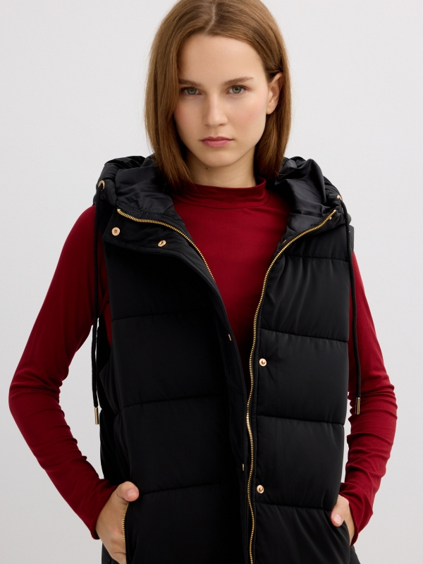 Long padded vest with hood black detail view
