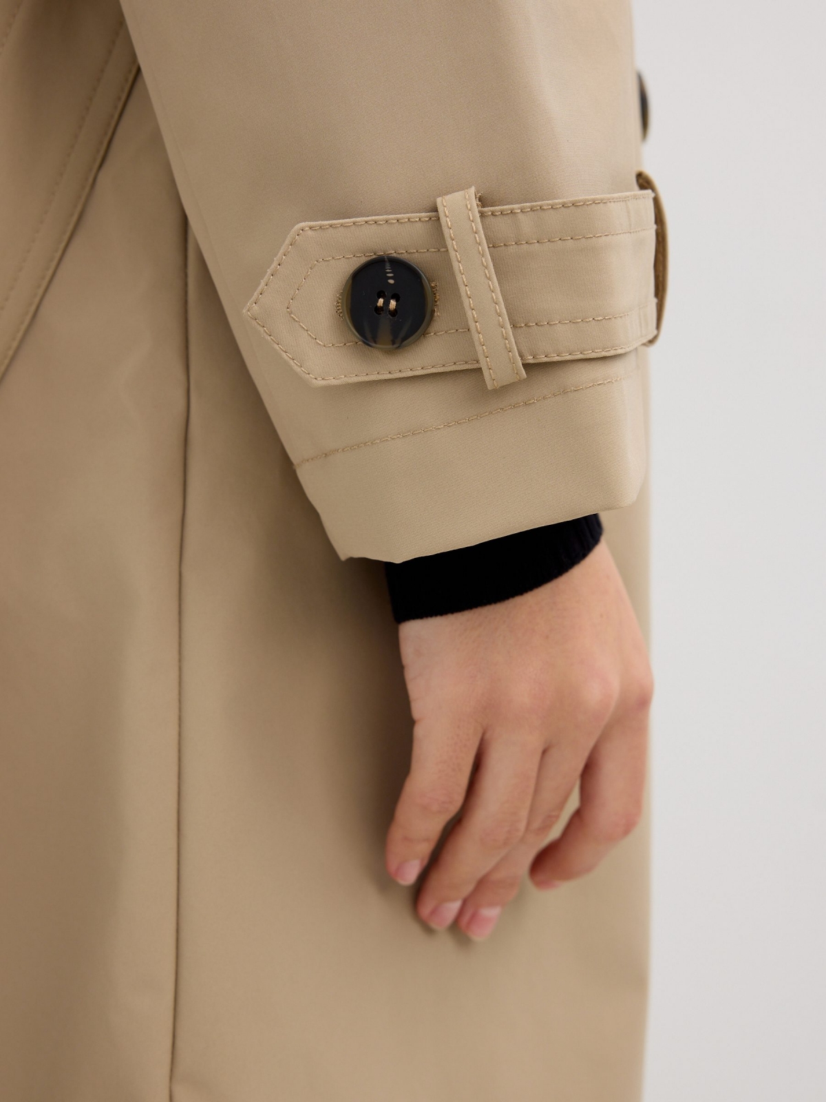 Long trench coat sand detail view