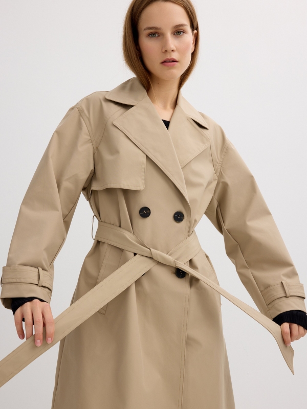 Long trench coat sand detail view