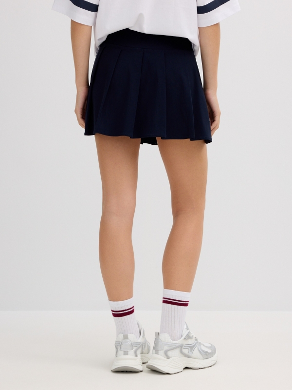 Pleated mini skirt navy front view