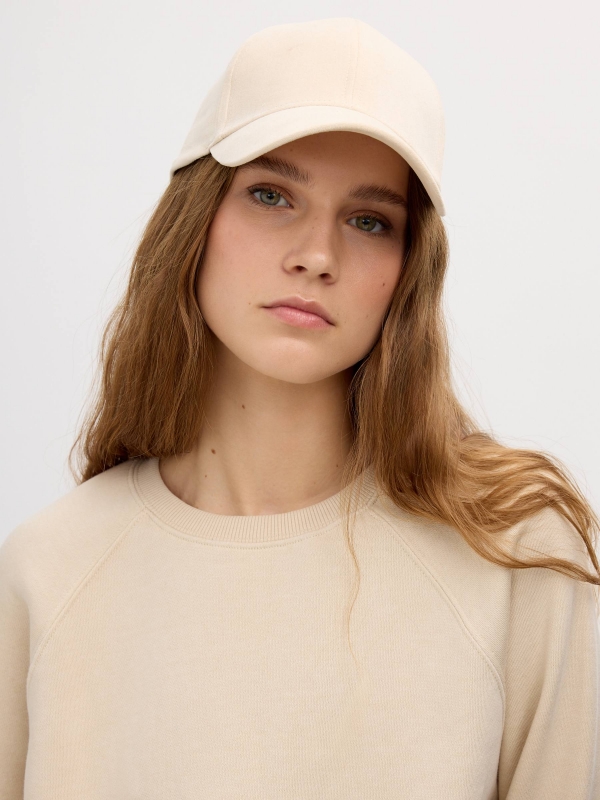 Microfiber cap beige with a model Microfiber cap beige with a model