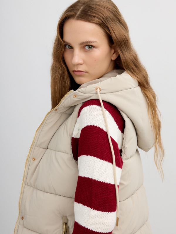 Long padded vest with hood taupe detail view