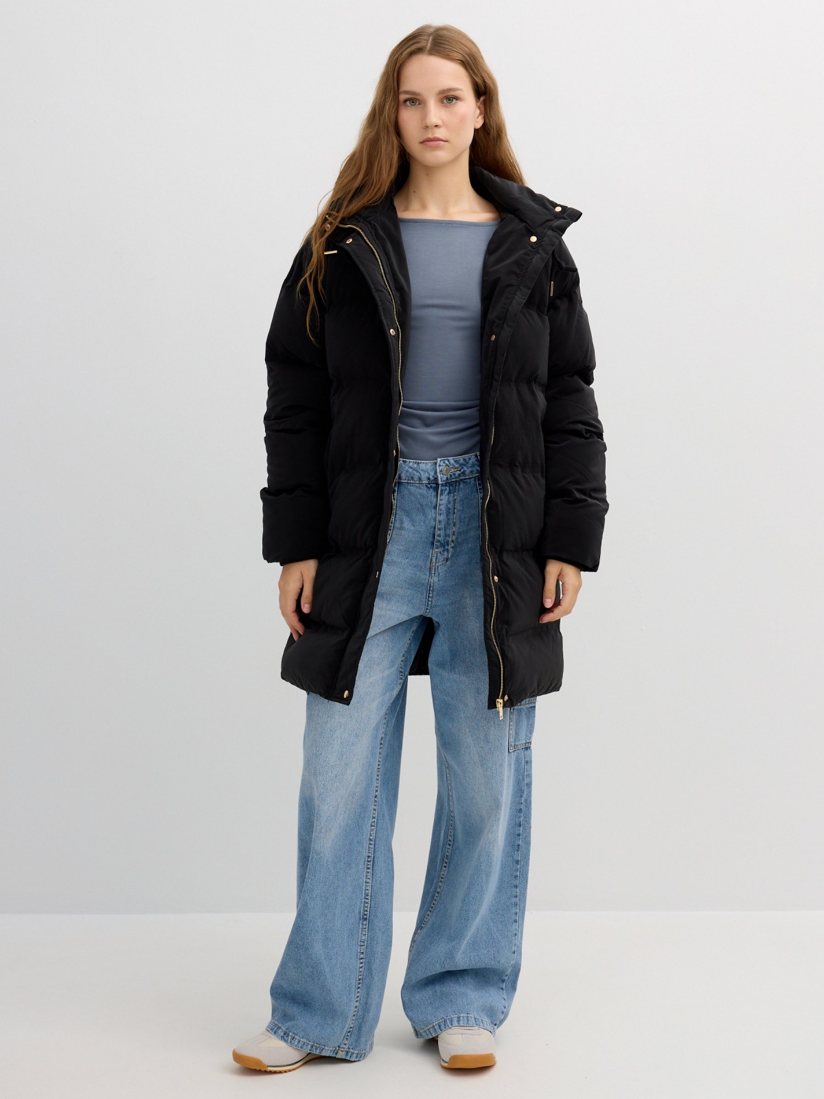 Long padded anorak with hood black front view