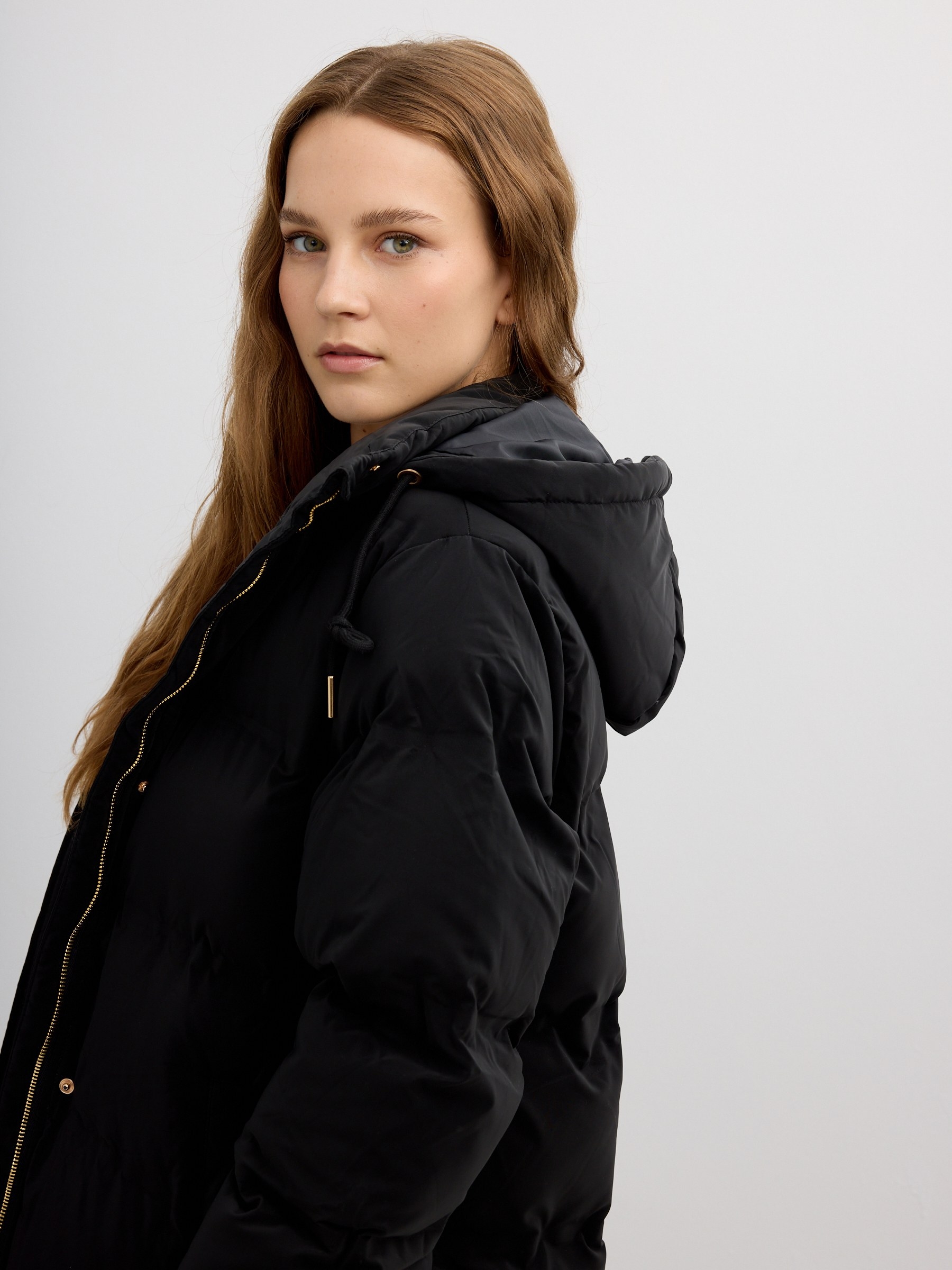 Long padded anorak with hood black middle front view