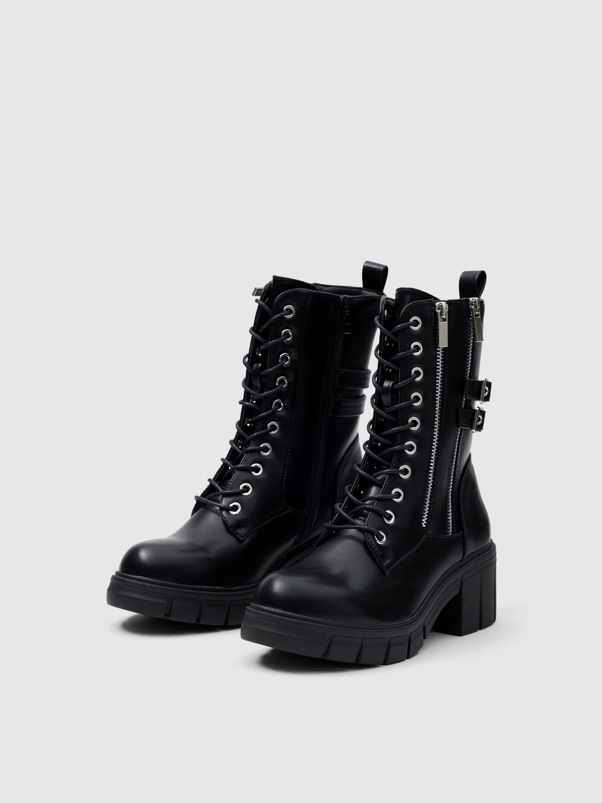 Ankle boots with studs and buckles black 45º front view