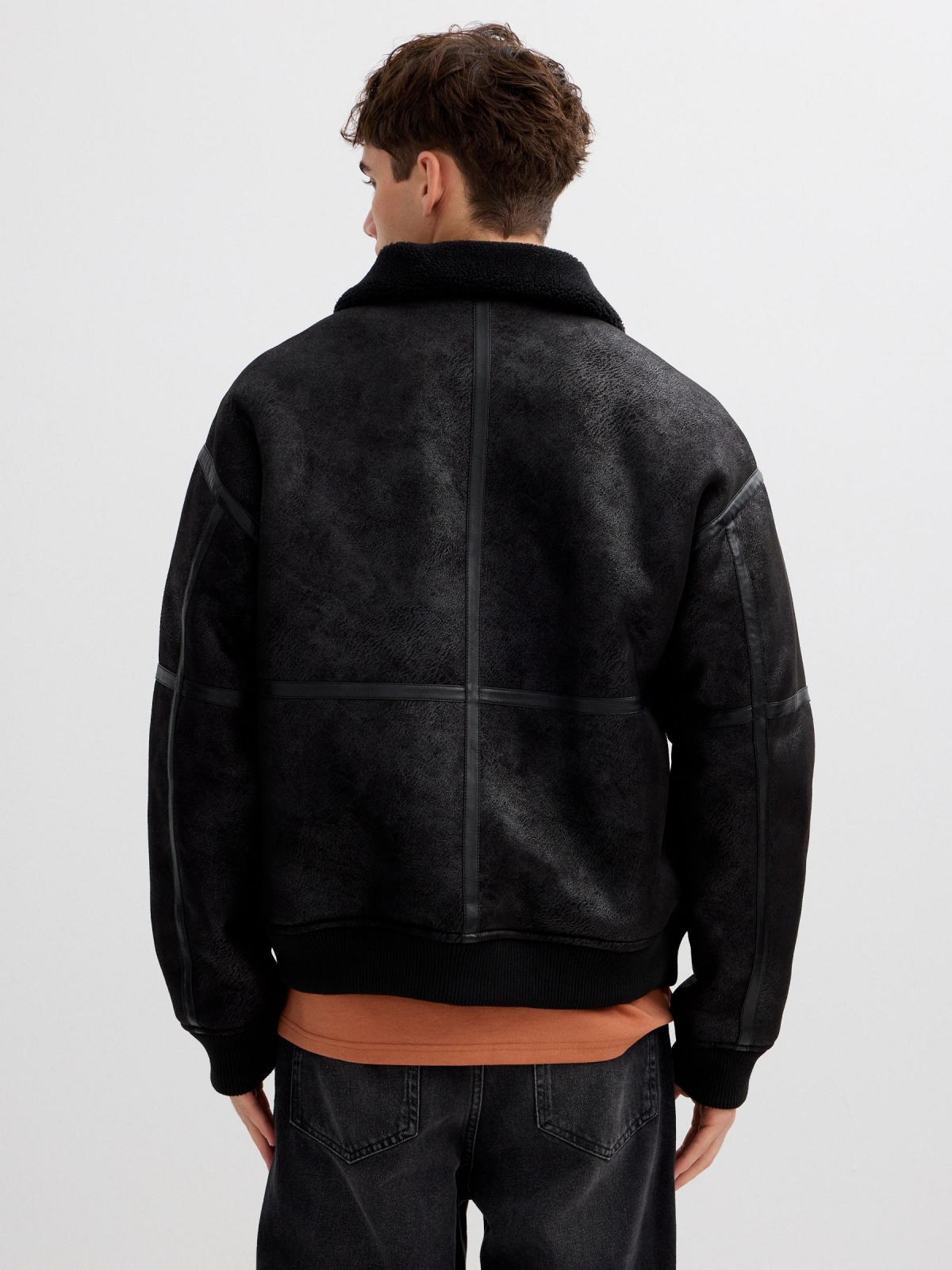 Faux leather jacket combined with shearling black middle back view