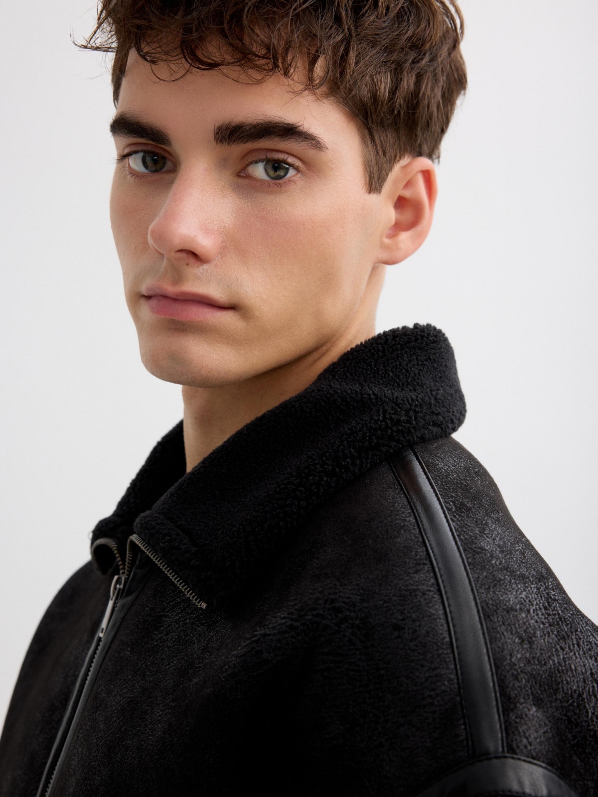 Faux leather jacket combined with shearling black detail view