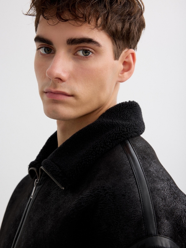 Faux leather jacket combined with shearling black detail view