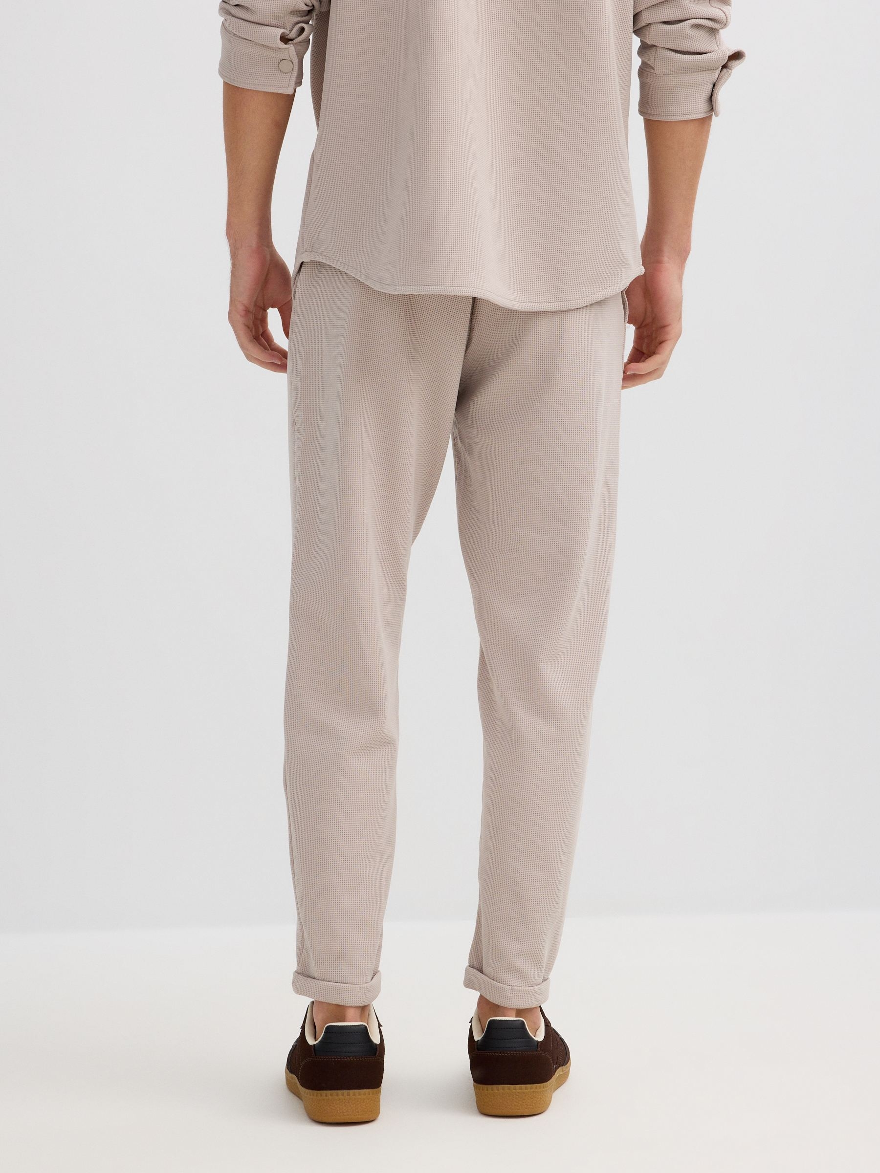 Beige fleece sports jogger raw front view