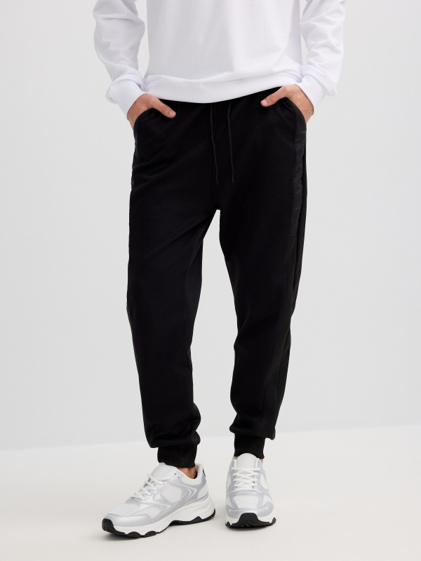 Jogger desportivo felpa preto preto vista meia frontal