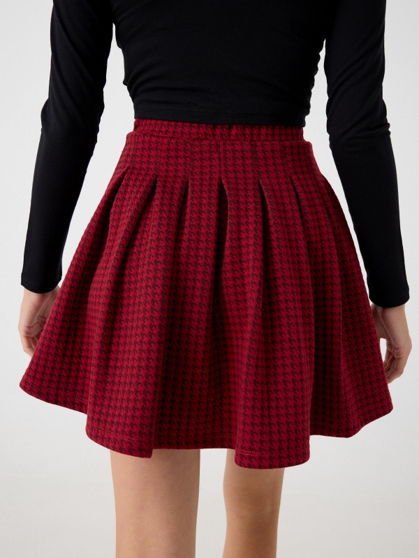 Houndstooth flared skirt garnet detail view