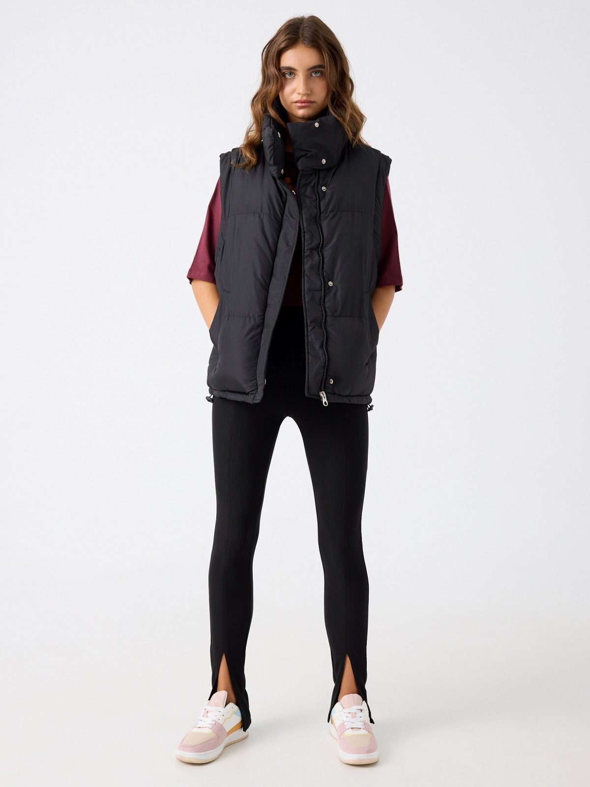 Puffy turtleneck vest black front view