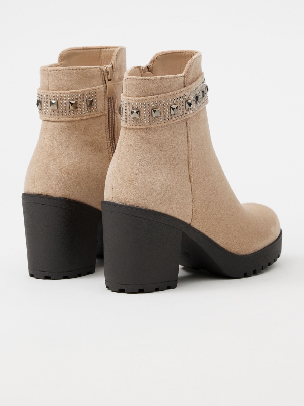 High-heeled ankle boot with studs beige 45º back view