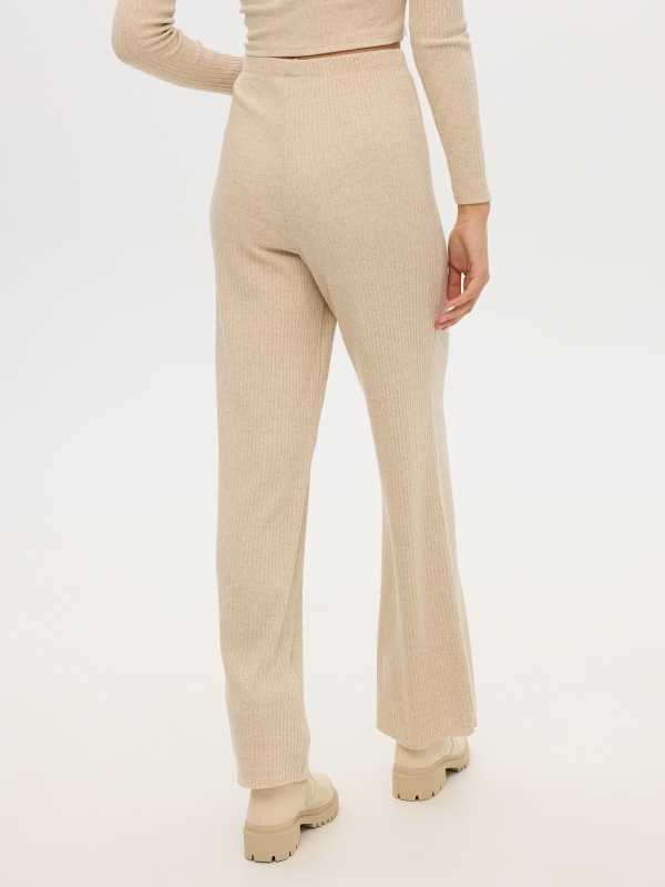 Fluid beige pants beige middle back view