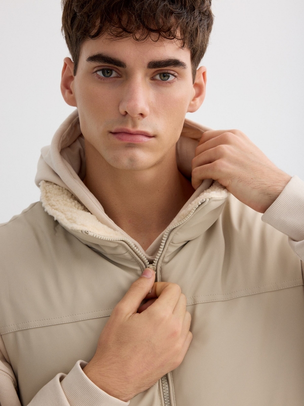 Beige padded nylon vest raw detail view
