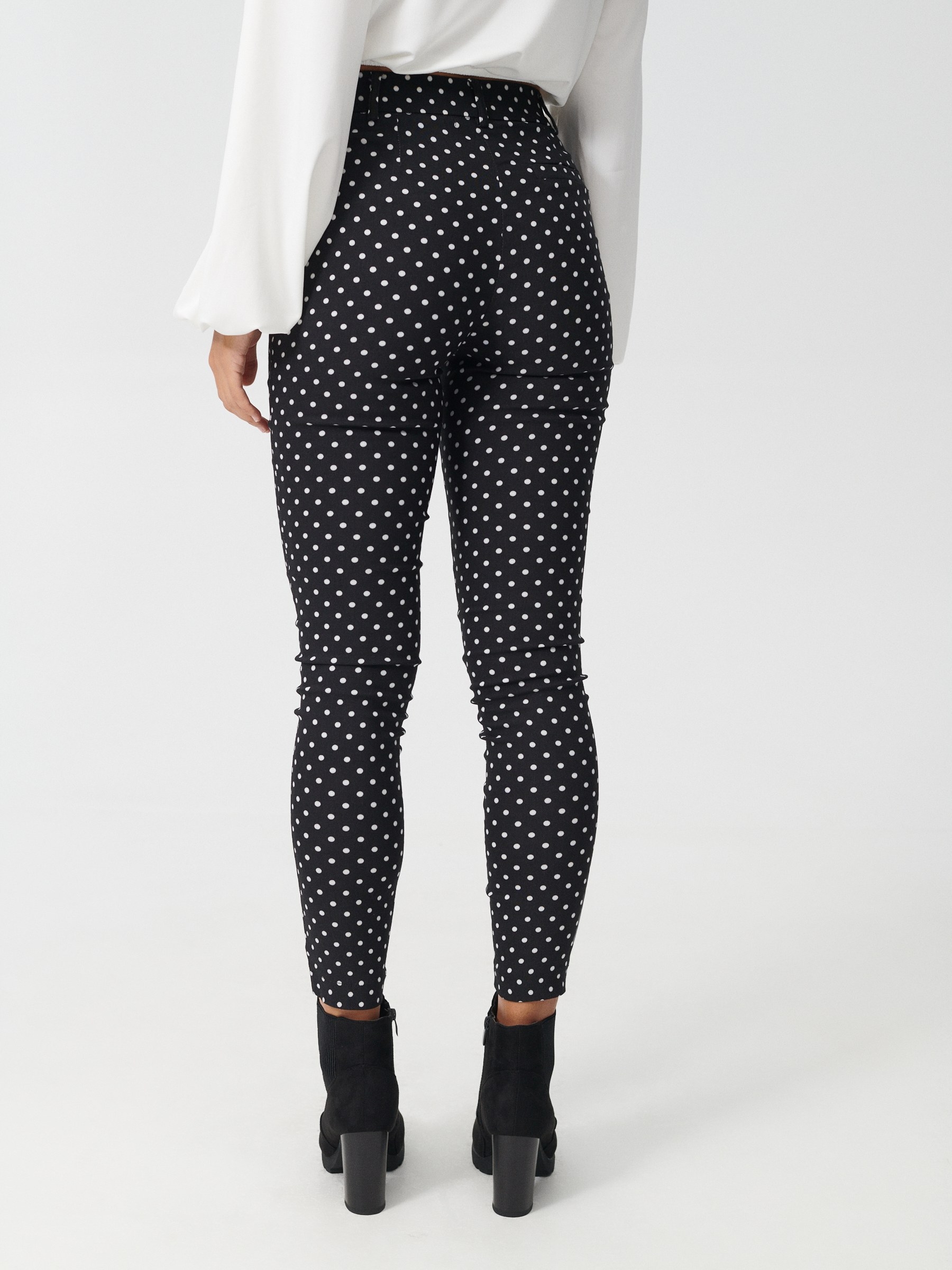 Stretch polka dot print trousers black