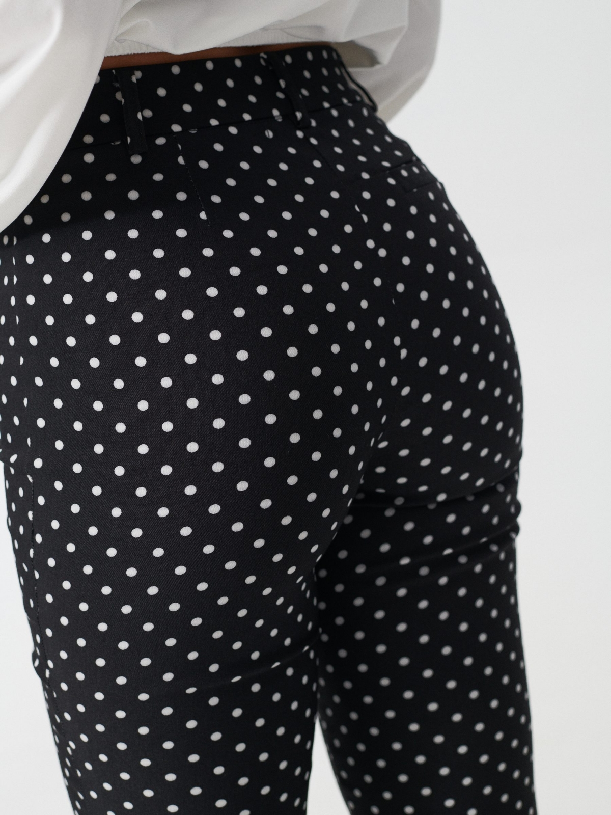 Stretch polka dot print trousers black