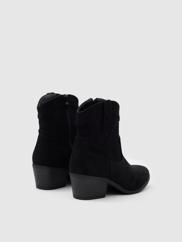 Black cowboy boots 45º back view