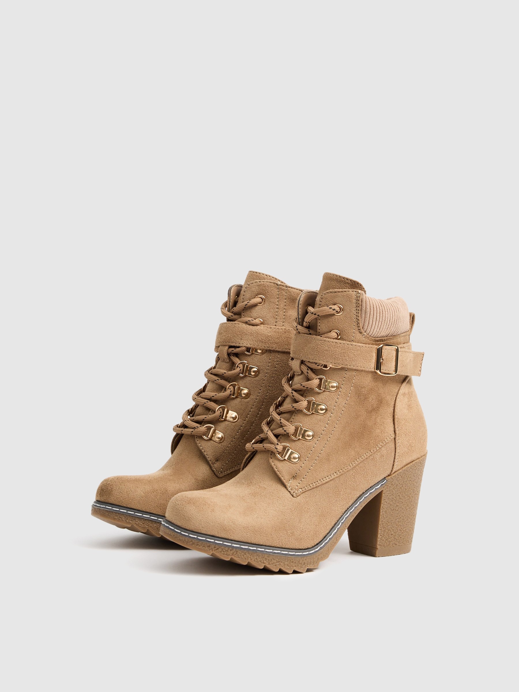 Brown ankle boots with heels beige profile view