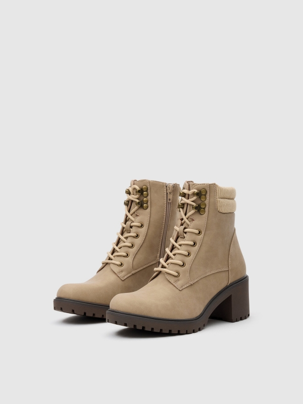 Ankle boots with leatherette collar beige 45º front view