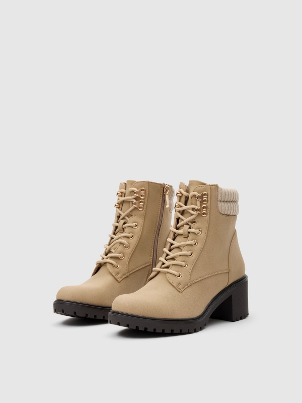 Ankle boots with buckle and collar beige 45º front view