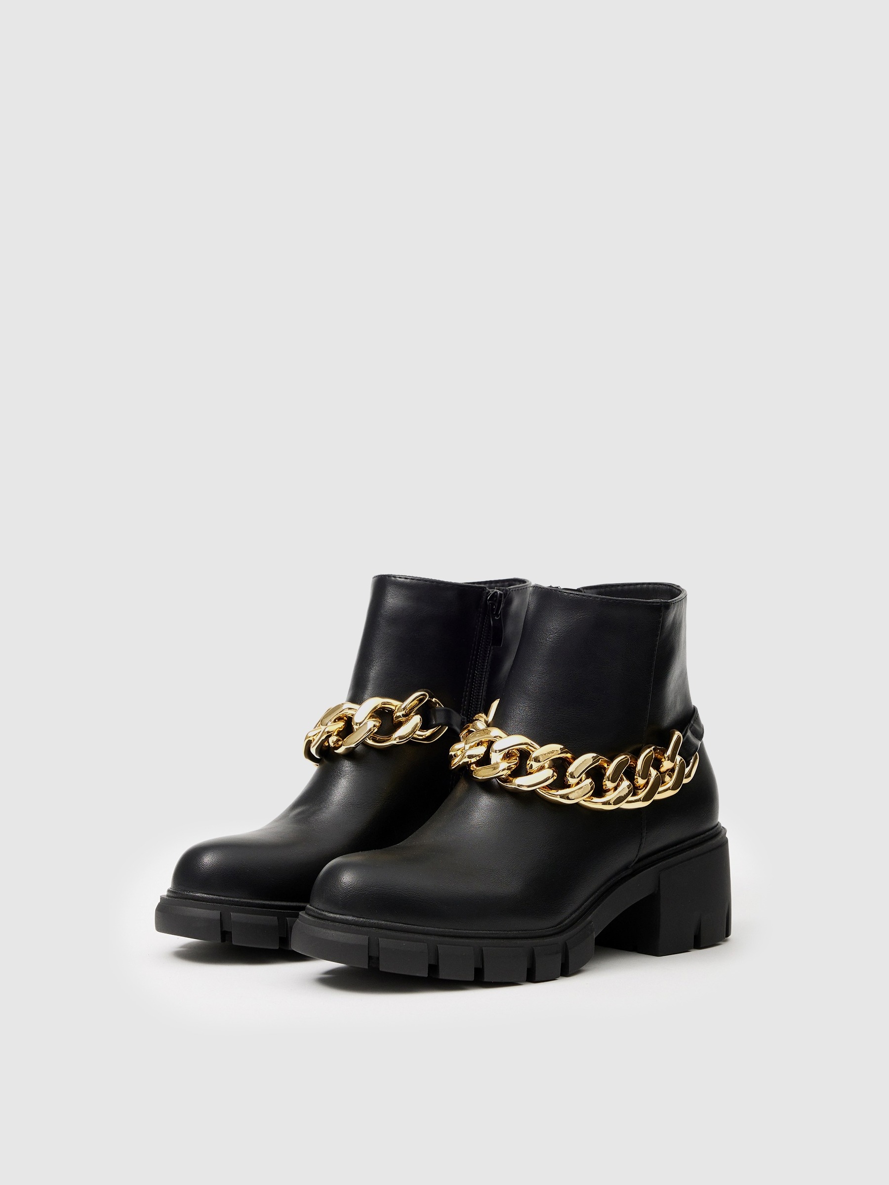 Golden chain high heel ankle boot black