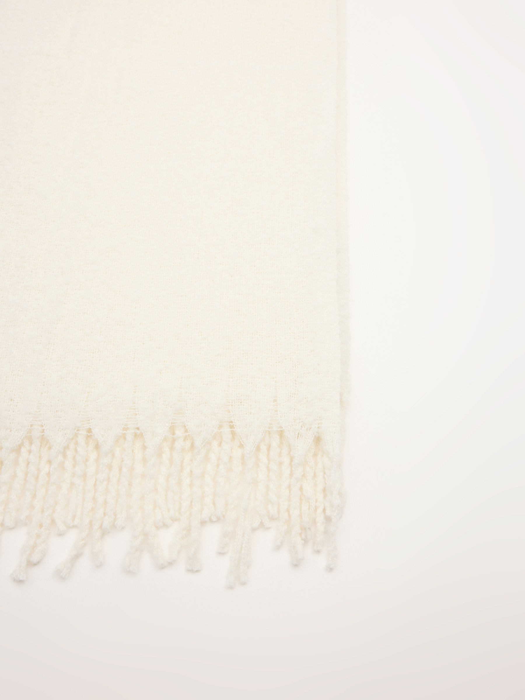 White fringed scarf beige rolled view