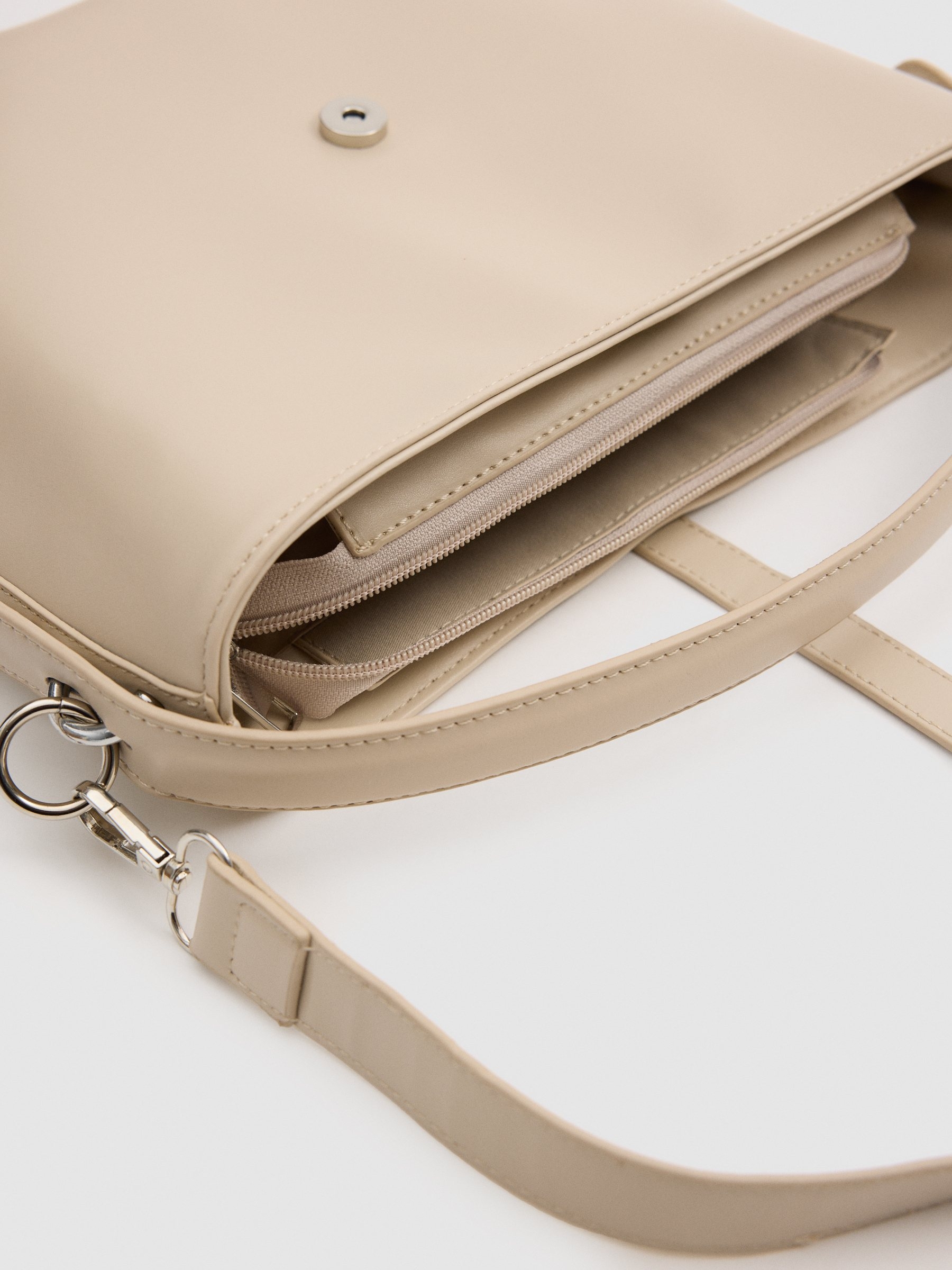 Beige faux leather bag beige front view