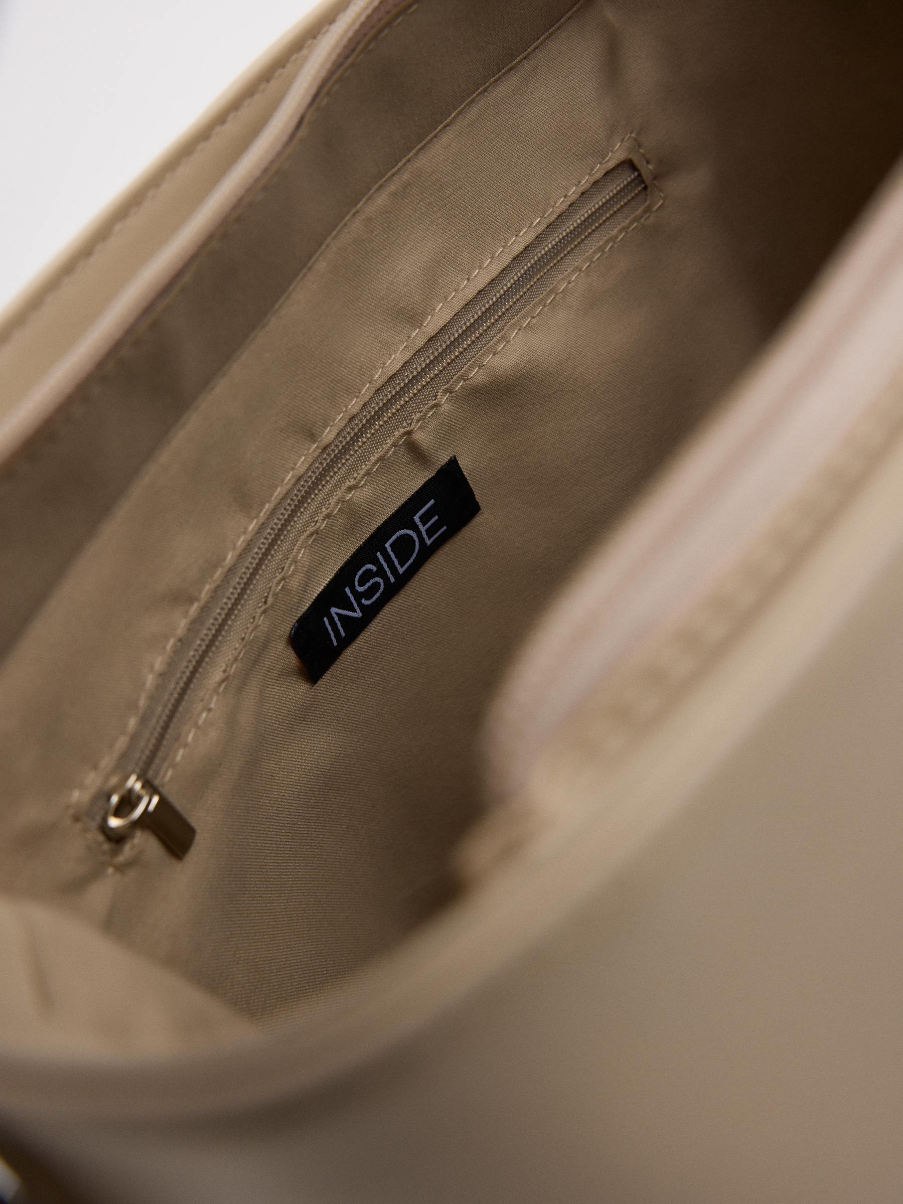 Beige faux leather bag beige front view