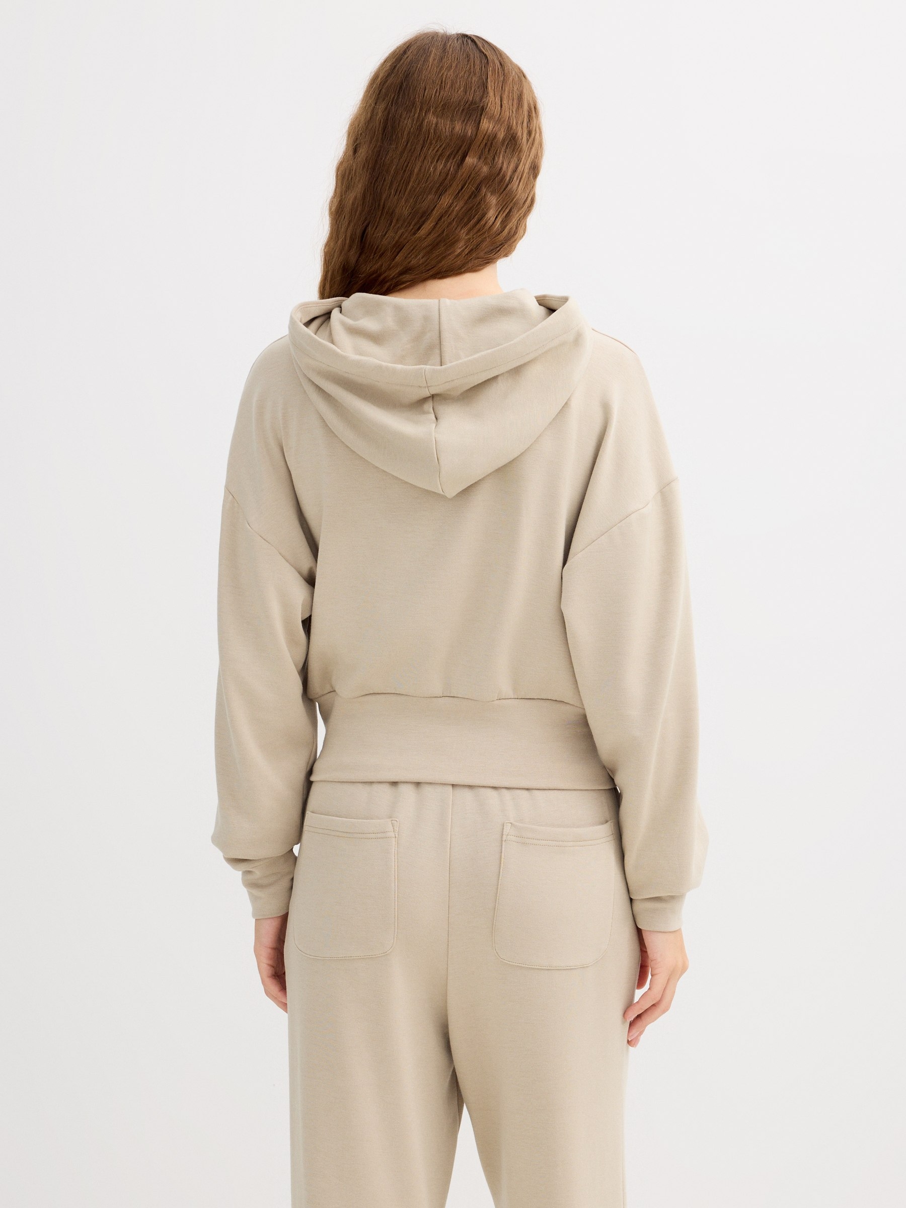 Sudadera con capucha y cremallera verde grisáceo vista media frontal