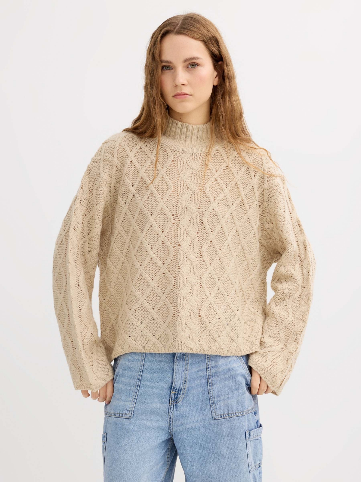 Cable knit sweater with a mock neck