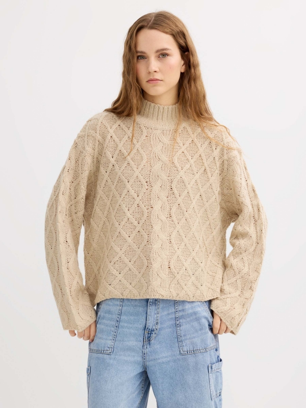 Cable knit sweater with a mock neck