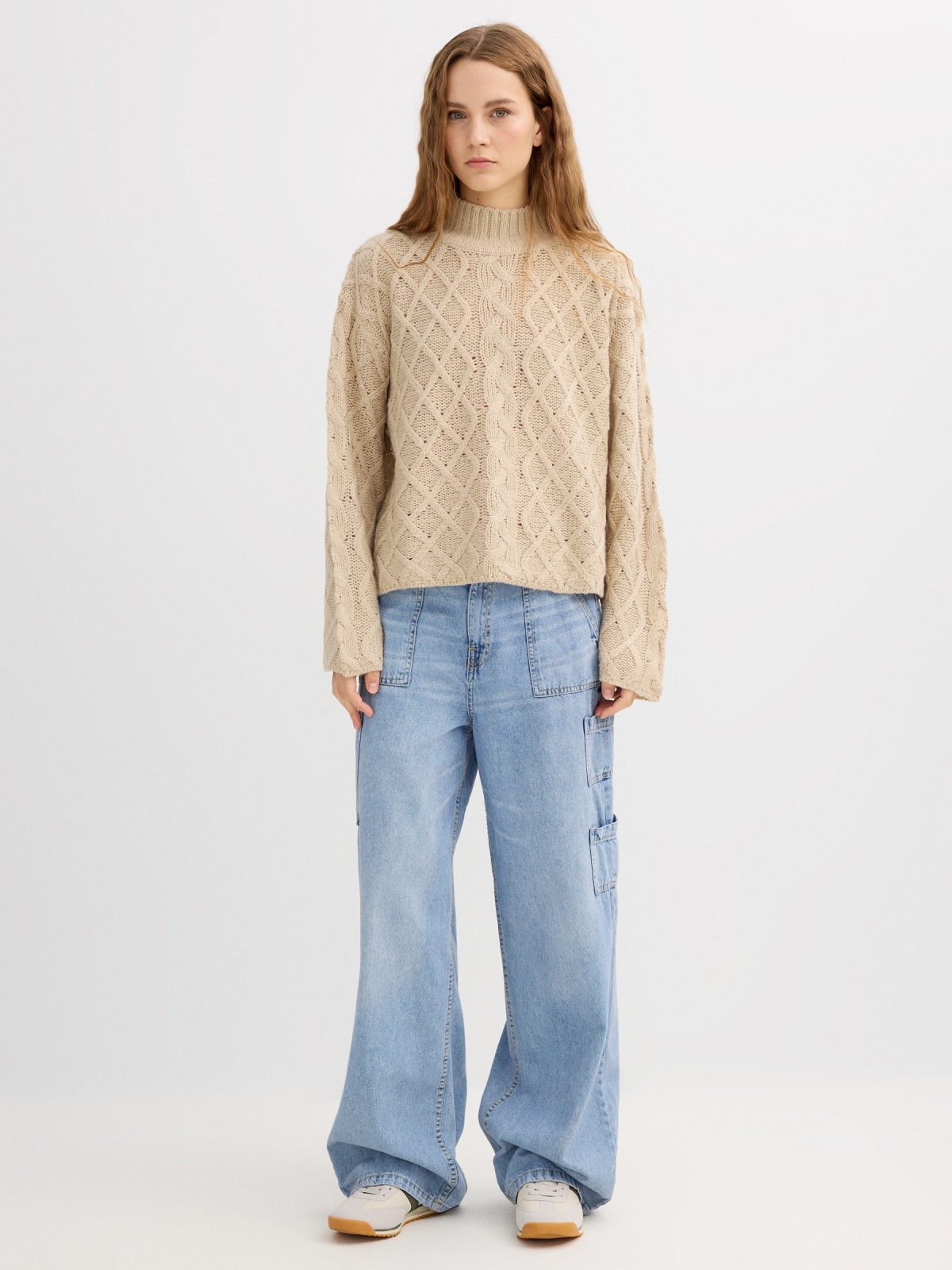 Cable knit sweater with a mock neck sand front view
