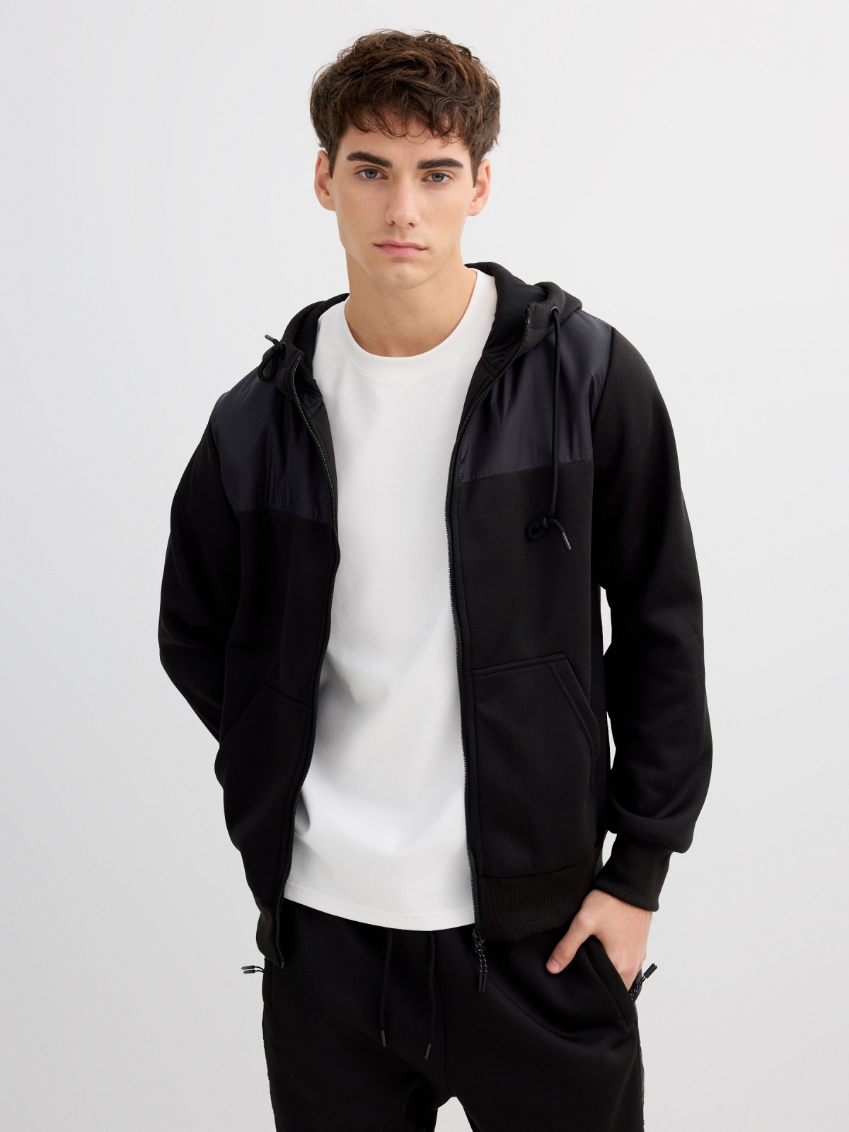 Sports hoodie with leather effect black detail view