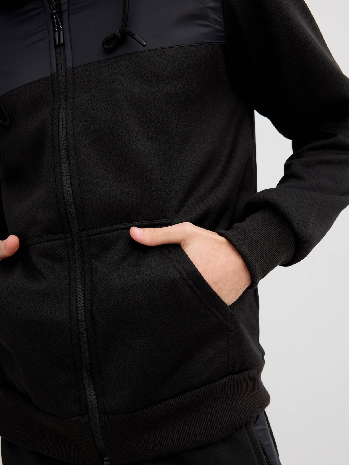 Sports hoodie with leather effect black detail view