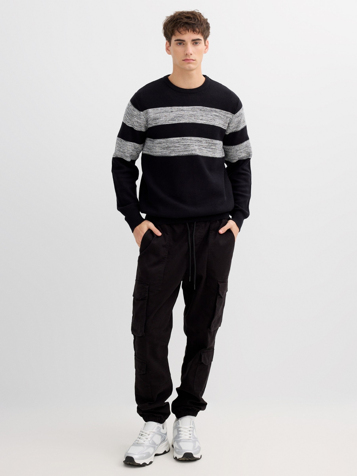 Striped knit sweater with a round neck black front view