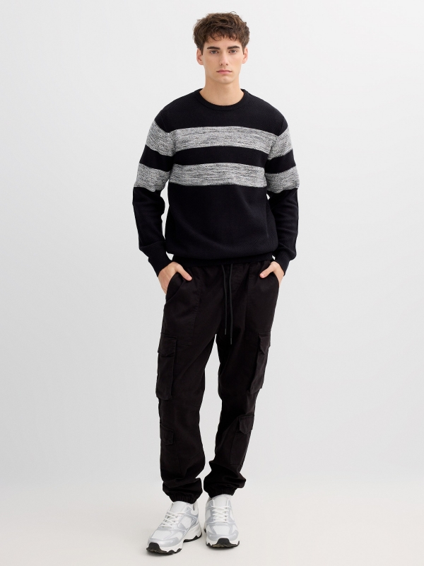 Striped knit sweater with a round neck black front view