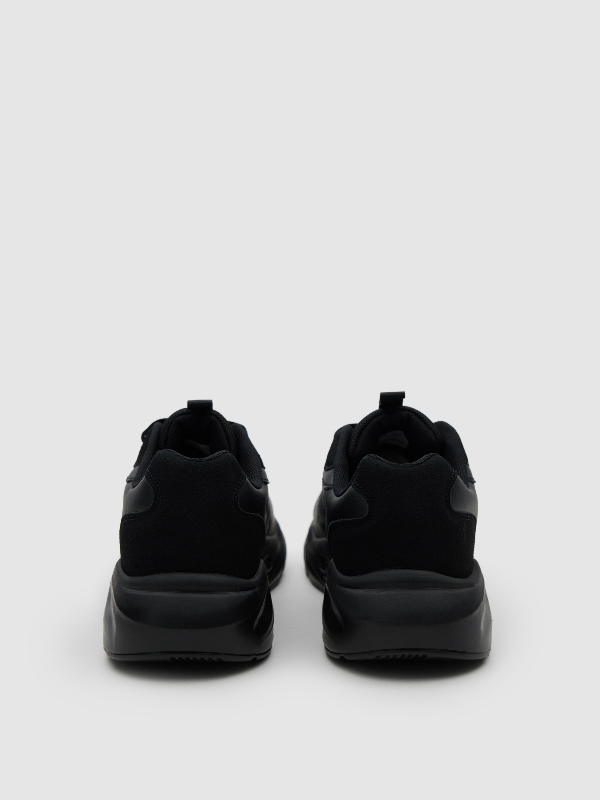 Sporty nylon combined with black leather effect black detail view